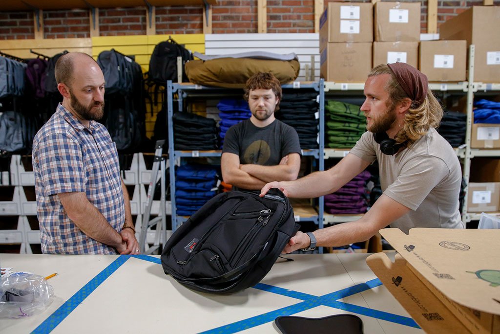 Mike, Nik, and Matt discussing shipping procedures and logistics.