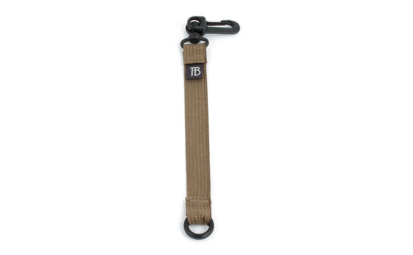 visible variant TB0515-CA^^An 8-inch Coyote (tan) Key Strap with a snaphook at one end and an o-ring at the other.